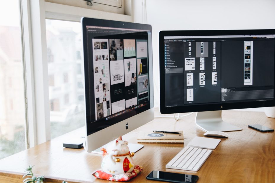 Silver Imac on Top of Brown Wooden Table