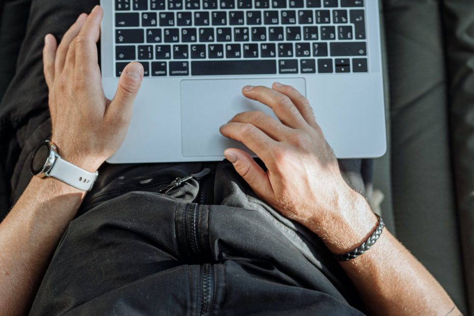 Free A Person Working on His Laptop Stock Photo